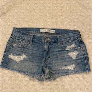 A&F distressed denim shorts with glitter accents